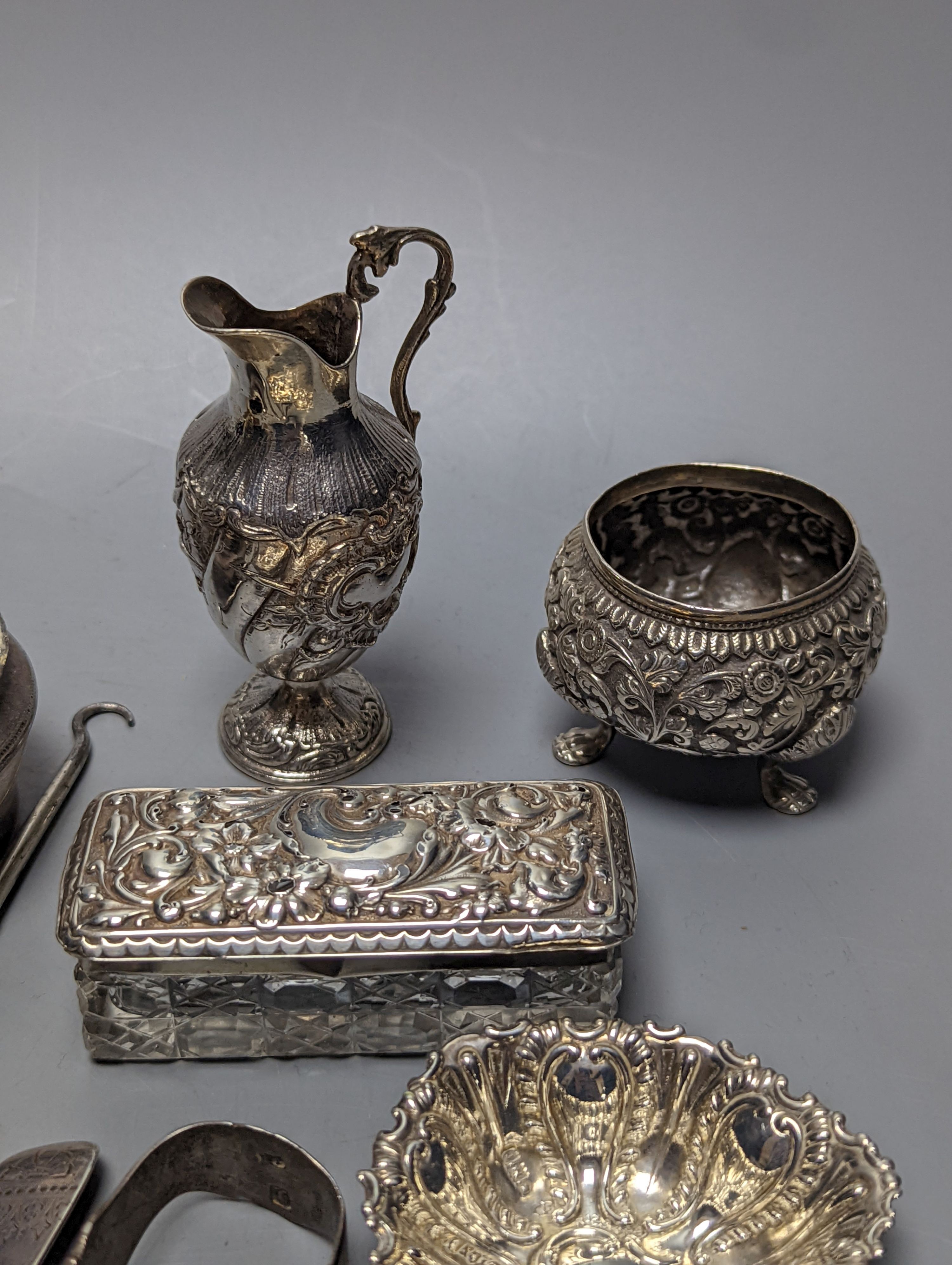 Mixed collectable small silver etc. including silver cream jug, clothes brush, mounted glass posy vase, sugar tongs, owl book mark, spoons and other items.